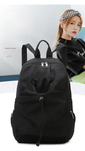 Detail of black waterproof backpack with drawstring pocket and large storage capacity