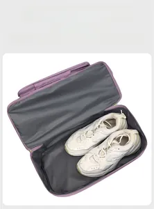 Detail showing a purple travel bag with a separate zippered shoe compartment for trainers
