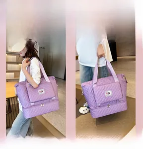 Detail of purple quilted nylon travel bag featuring bottom compartment and straps