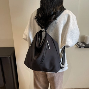 Minimalist black large capacity nylon tote backpack with multi-zipper pockets for daily commute