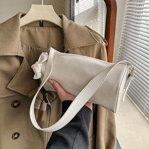 French minimalist cream cylinder shoulder bag with elegant bow button decoration