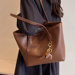 Brown large capacity leather tote bag with elephant charm and Fashion Trend print