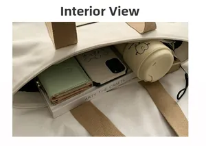 Interior view showing the large storage capacity of the beige canvas tote bag