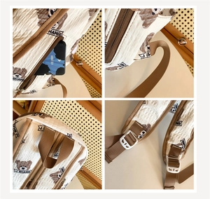 Detail view of beige quilted backpack showing side zipper, sturdy handle, and adjustable straps