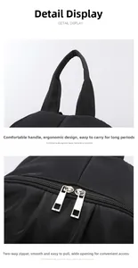 Detail of ergonomic handle and smooth dual zipper on large black travel backpack