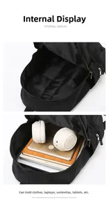 Detail view of a black backpack showing a large interior compartment with a laptop sleeve