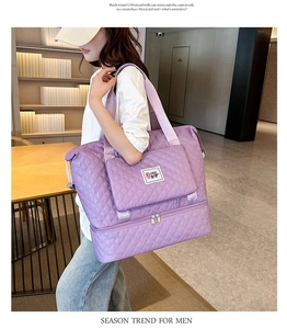Detail of purple quilted oxford travel bag showing the bottom wet-dry separation layer