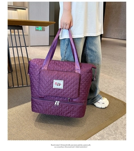 Detail view of deep purple quilted oxford fabric and double layer storage design