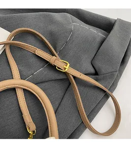 Adjustable khaki lychee grain leather shoulder strap with gold metal buckle detail