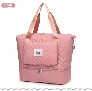 Detail of dark pink quilted oxford gym bag featuring a bottom shoe compartment