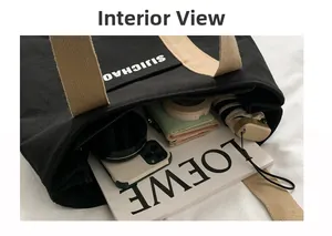 Top view of large black canvas tote bag showing spacious interior and secure zipper