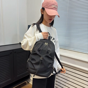 Fashionable black large capacity nylon backpack for women with drawstring and zipper design