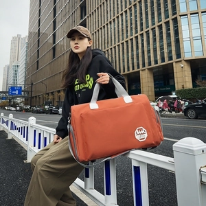 Grand sac de voyage orange en tissu Oxford avec écusson 1979 et bandoulière amovible