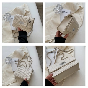 Detailed views of cream quilted crossbody bag with silver hardware and chain strap