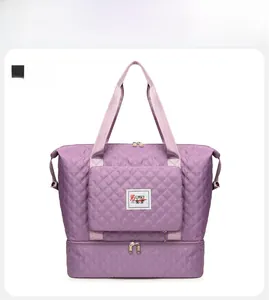Detail view of purple quilted oxford travel bag with separate shoe compartment