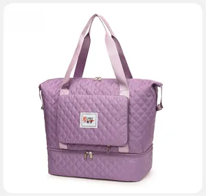 Detail view of purple quilted oxford travel bag with separate bottom shoe compartment