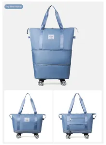Detail of fog blue foldable Oxford bag with smooth swivel wheels and multi-layer zipper design
