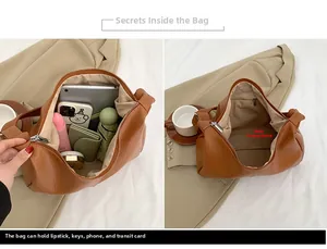 Detail of brown litchi pattern PU tote bag showing spacious interior and metal zipper