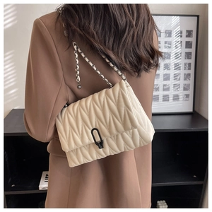 Detailed back view of an elegant quilted crossbody bag with stylish gold chain strap