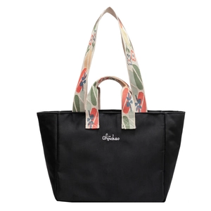 Borsa tote in nylon nero con manici a fiori colorati e logo bianco per il pendolarismo