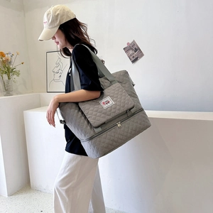 Quilted gray Oxford tote bag with bottom shoe compartment for travel and sports fitness