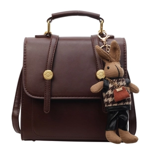 Vintage dark brown faux leather backpack with top handle and cute rabbit charm accessory