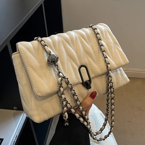 White quilted crossbody bag with V-stitch texture and elegant black metal chain strap