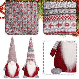 Set of two Christmas faceless gnomes with knitted heart and snowflake patterns