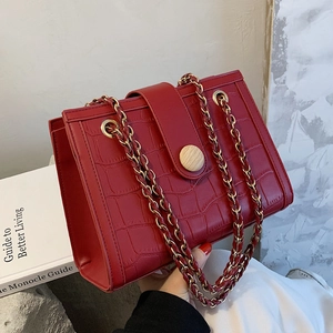 Elegant red crocodile texture wedding crossbody bag with gold chain and wooden button accent