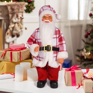 Classic 12 inch Santa Claus figurine with red plaid outfit in a cozy holiday home setting