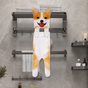 Macro detail of a hanging Corgi-shaped hand towel in orange and white coral fleece