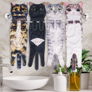 Hanging cat hand towels in four colors with paw snaps on a bathroom towel rack