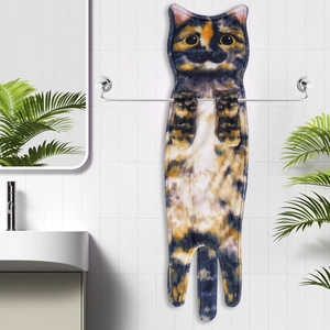 Detail of hanging cat-shaped hand towel showing soft microfiber texture and calico cat pattern