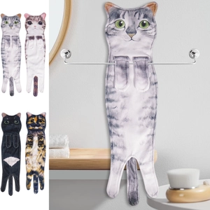 Close-up of four absorbent cartoon cat hand towels in a modern bathroom setting
