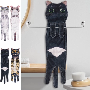 Detail showing various realistic cat-shaped hanging towels in a modern bathroom setting