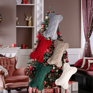 Detailed close-up of 5-color cable knit bone-shaped stockings for Christmas tree decor