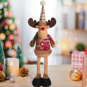 Detail of Christmas reindeer plush doll with knit hat and scarf for holiday decor