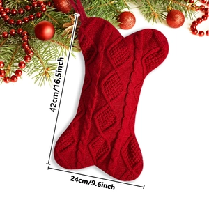 Detailed view of red bone-shaped cable knit Christmas stocking with size measurements