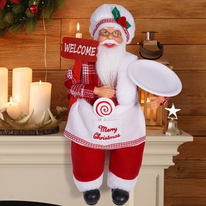 Detail of chef Santa Claus figurine with Welcome sign and tray on a festive mantel