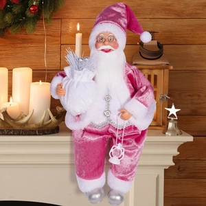 Pink velvet Santa Claus figurine holding silver gift bag and lantern on mantelpiece
