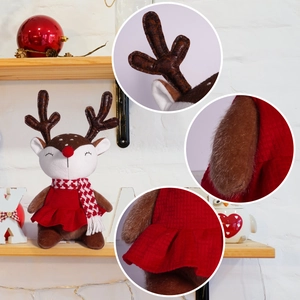 Cute Christmas reindeer doll with red scarf and skirt on a festive shelf display