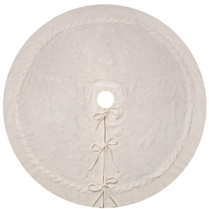 Round cream cable-knit Christmas tree skirt with ribbon bows on a white background