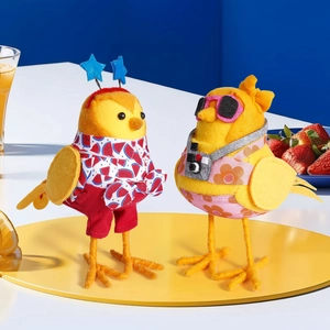 Detail of handcrafted felt birds in summer outfits with watermelon and floral patterns