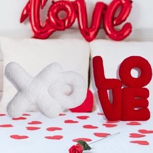Detailed texture of fleece fabric on LOVE and XO shaped Valentine decorative pillows