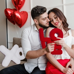 Detail of red plush LOVE letters and white XO symbols for Valentine home decor