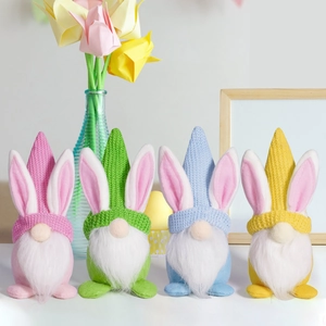 Set of four colorful Easter gnome dolls with bunny ears displayed on a white surface