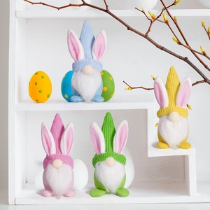 Detailed view of colorful knitted Easter gnomes with rabbit ears and long white beards
