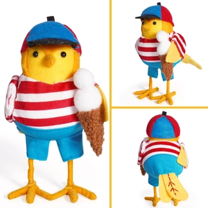 Detail of yellow bird figurine wearing summer hat and striped shirt with ice cream
