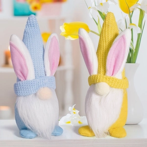 Close-up of Easter gnomes with bunny ears and long white beards in blue and yellow