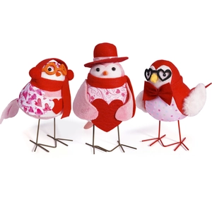 Three Valentine's Day themed plush birds with hearts and glasses for table decor